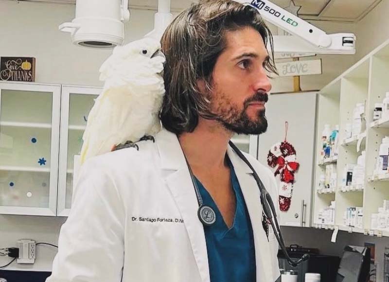 veterenarian with bird on shoulder